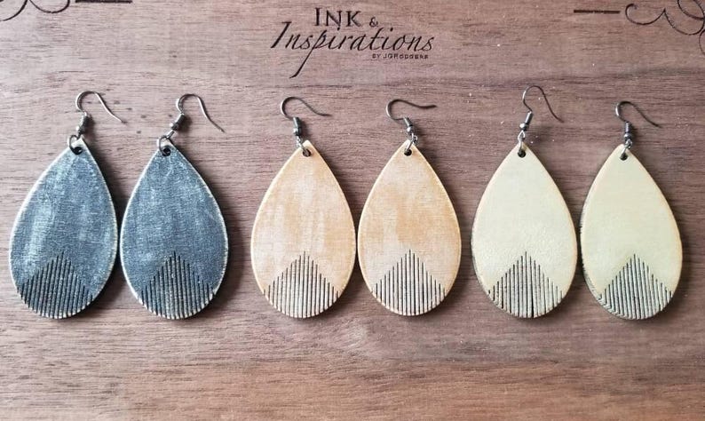 Country Western Fringe Wood Earrings available in 3 colors and 3 sizes. They are rustically painted in black, camel and Off white in a teardrop shape.