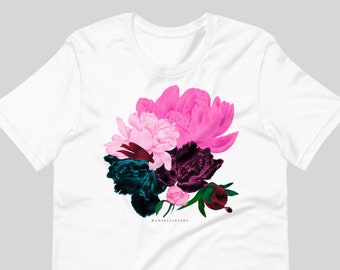May include: White t-shirt with a floral design featuring pink, dark green, and burgundy peonies. The text "#anneliakinde" is printed at the bottom of the design.