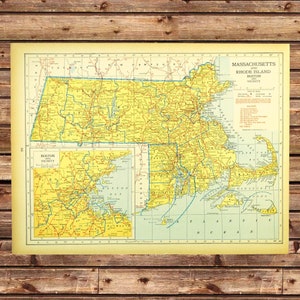 May include: Vintage map of Massachusetts and Rhode Island, showing the Boston vicinity. The map is yellow and blue with red lines and text. The map is framed by a white border.