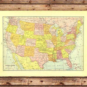 May include: A vintage map of the United States, showing state borders and major cities. The map is printed in yellow, orange, and pink on a cream-colored background.