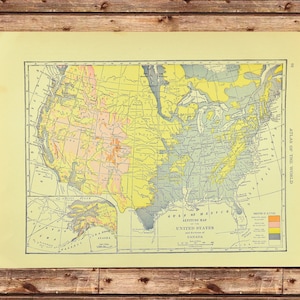 May include: A vintage map of the United States and portions of Canada, with color-coded altitude variations. The map, titled "Atlas of the World," features detailed geographical information and is printed on aged paper. The map includes the Gulf of Mexico and the Arctic Ocean.