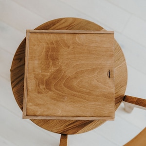 Preserve your most treasured moments with this wedding album box, crafted to hold a 10x10 album box securely. Made from high-quality wood, this wooden album box is perfect as a memory box or wooden memory box for sentimental keepsakes. Personalize it as an engraved box for a unique touch. A thoughtful keepsakes box, this large wooden box ensures your special memories are stored safely in a beautifully designed personalised box.