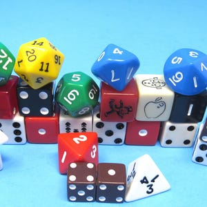 May include: A collection of colorful dice in various shapes and sizes, including six-sided, ten-sided, and twenty-sided dice. The dice are red, green, yellow, blue, black, white, and brown, with white numbers. A fun assortment for tabletop games.