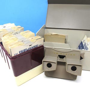 This is a Vintage Viewmaster That Works Well And Comes With 125 Reels, All In 2 Vintage Viewmaster Storage Boxes