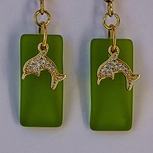 Nautical rectangular peridot sea glass style earrings with cubic zirconia dolphins