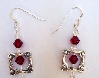 Dangling sterling silver &quot;Ocean waves&quot; bead frame earrings with fuschia and clear swarovski crystals on sterling ear wires. All year gift