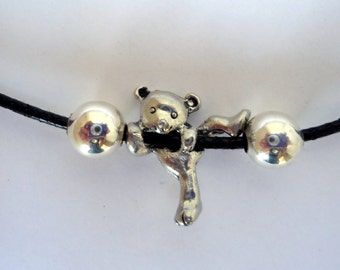 OAK Cute black leather necklace with hanging pewter teddy and silver plated beads with extension, and daisy charm