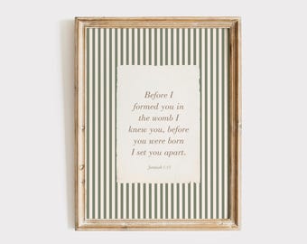 May include: Framed print with a light wood frame. The background features vertical stripes in white and olive green. A textured, off-white rectangle in the center displays the text: "Before I formed you in the womb I knew you, before you were born I set you apart." Jeremiah 1:15.