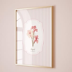 May include: A framed print with a pink and white striped background. The center of the print features a white oval with a pink floral illustration and the text "August GLADIOLUS".