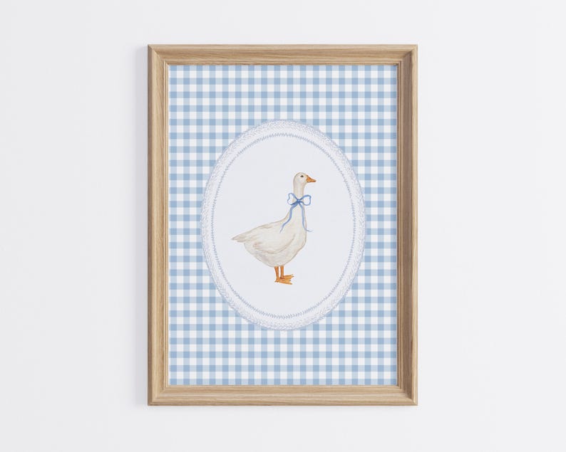 May include: A framed print of a white goose with a blue bow tie on a blue and white gingham background.