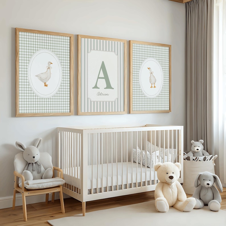 May include: Three framed wall art prints featuring a light green and white gingham pattern. The two outer prints display a watercolor illustration of a goose inside an oval frame. The center print features a large letter A and the name Adrian.