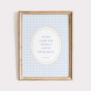 May include: A framed print with a blue and white gingham background. The print features a white oval with a gold border and the text "Every good and perfect gift is from above." with the scripture reference "James 1:17".