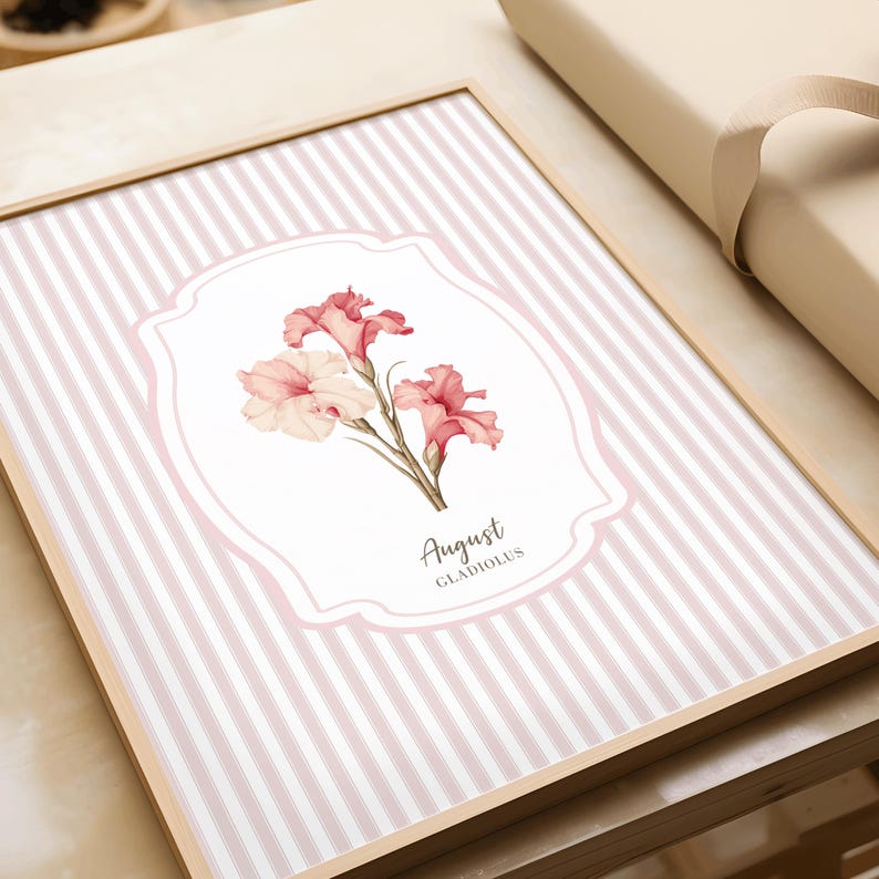 May include: A pink and white striped background with a white oval frame. Inside the frame is a watercolor illustration of pink and white gladiolus flowers. The text "August Gladiolus" is written below the flowers.