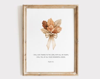 May include: A framed print with a watercolour illustration of autumnal leaves in brown and beige, tied with a ribbon. The print includes the text "I WILL GIVE THANKS TO THE LORD, WITH ALL MY HEART; I WILL TELL OF ALL YOUR WONDERFUL DEEDS. Psalm 9:1."