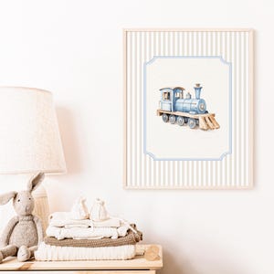 May include: A blue and brown toy train with a white background. The train is on a white background with blue and white stripes.