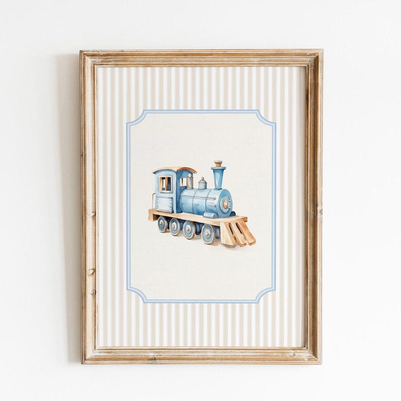 May include: A framed watercolor illustration of a blue toy train with a white background and a light blue and white striped border.