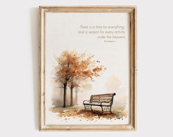 May include: Framed watercolour print depicting a park scene with a bench and trees in autumn colours. The text reads: "There is a time for everything, and a season for every activity under the heavens." Ecclesiastes 3.