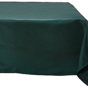 May include: A dark emerald green tablecloth, draped over a table. The fabric has a subtle sheen, and the edges are neatly hemmed. The tablecloth is a solid colour, suitable for various events.