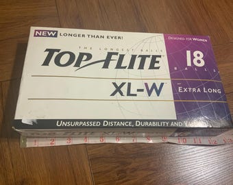 Vintage 1996 top elite XL- W Spalding women golf balls, missing one ball, good conditIon, makes a great golf collection balls for golf pro