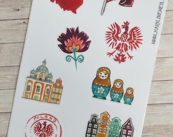 May include: A sticker sheet featuring illustrations of Poland, including a map, a flag, a red eagle emblem, a floral design, a building, three nesting dolls, a circular Poland stamp, and colourful townhouses with the text GDAŃSK and WWW.MARYLINEWEYL.COM.