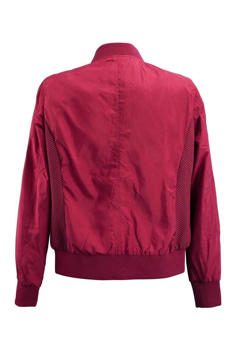 May include: A burgundy bomber jacket with a ribbed collar, cuffs, and hem. The jacket has a smooth, shiny finish and a subtle mesh panel on the sides.