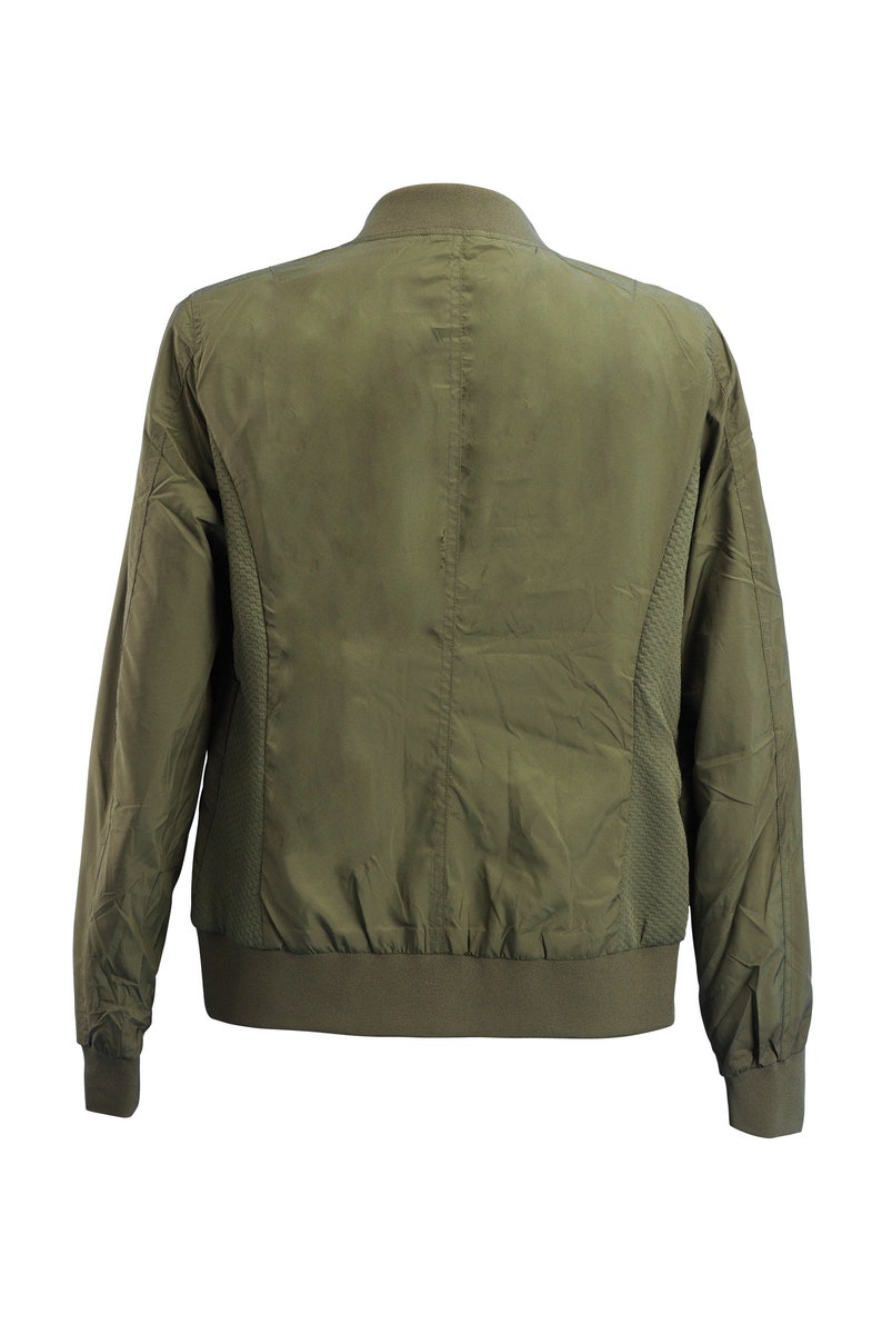 May include: A green bomber jacket with a zipper closure and ribbed cuffs and hem.