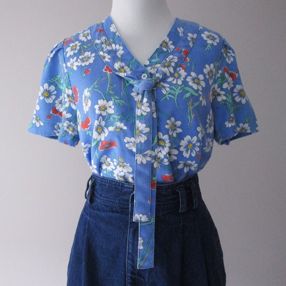ML 1970s orange and blue abstract blouse 70s vintage pussy bow draped button-front rayon shirt with abstract floral print