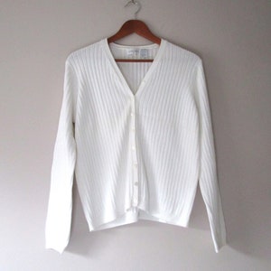 White sweater with clearance buttons