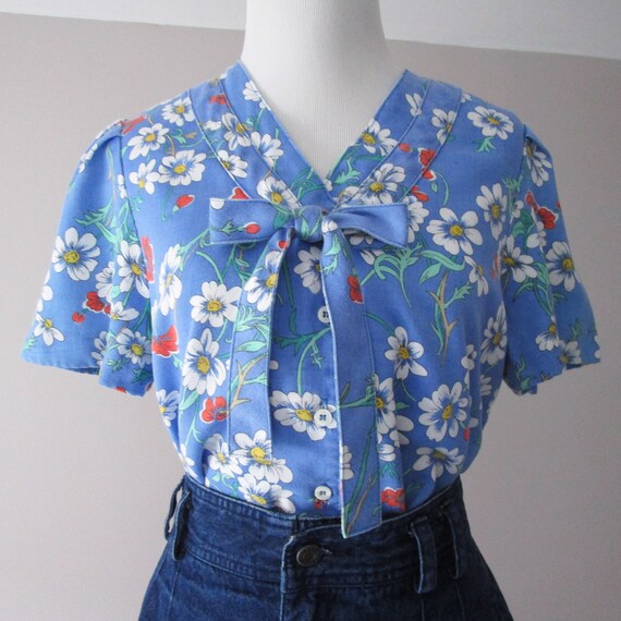 ML 1970s orange and blue abstract blouse 70s vintage pussy bow draped button-front rayon shirt with abstract floral print