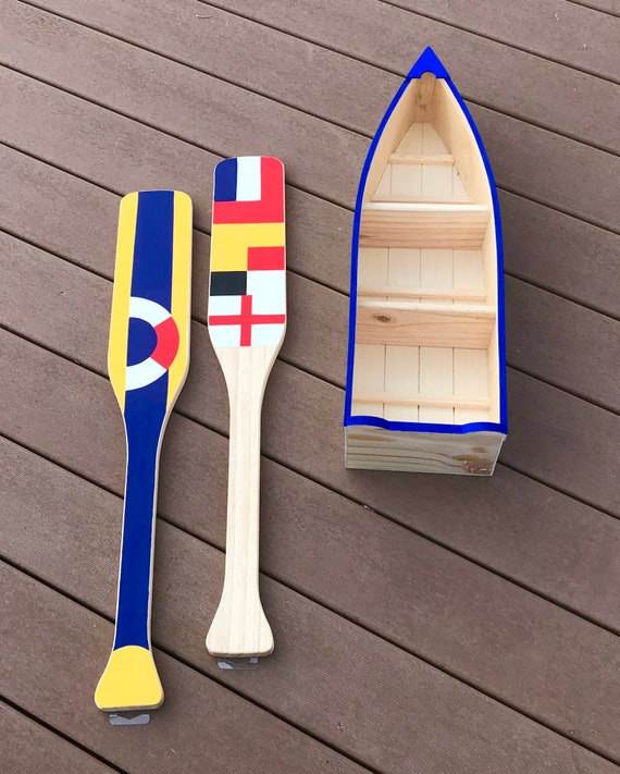 Plain Wood Boat With Oars. Unfinished Wooden Kayak, Row Boat