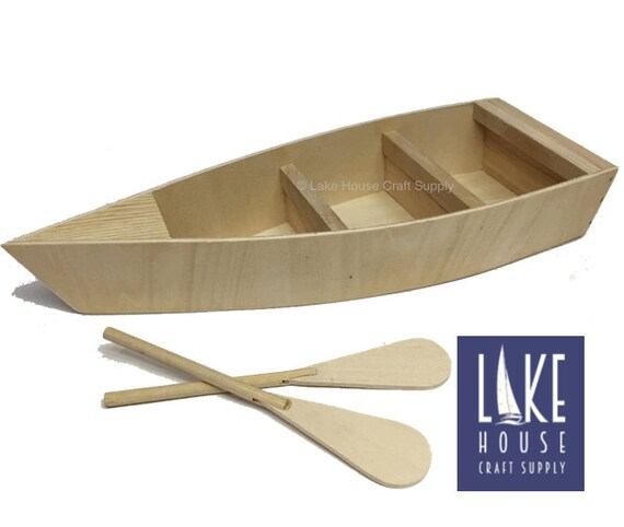 Plain Wood Row Boat. Bare Wood Boat with Oars. Fishing Boat