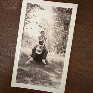Vintage 1930s  Snapshot Photo Unusual Woman Riding A Dinosaur Statue In The Woods!
