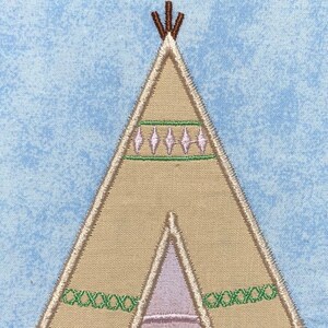 May include: A beige embroidered teepee with green and pink details. The teepee has a brown top with three sticks.
