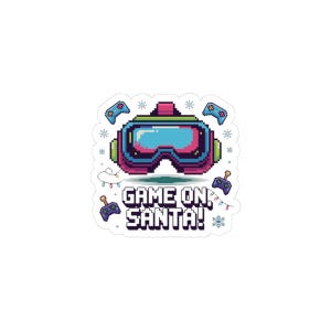 Puede incluir: Una pegatina con un casco de realidad virtual pixelado en rosa, verde y azul, con el texto "GAME ON, SANTA!" en blanco. El diseño incluye mandos de juego y copos de nieve, lo que sugiere un tema de juego navideño.