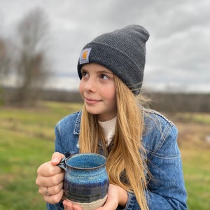 girl holding a Navy Ceramic Coffee Mug