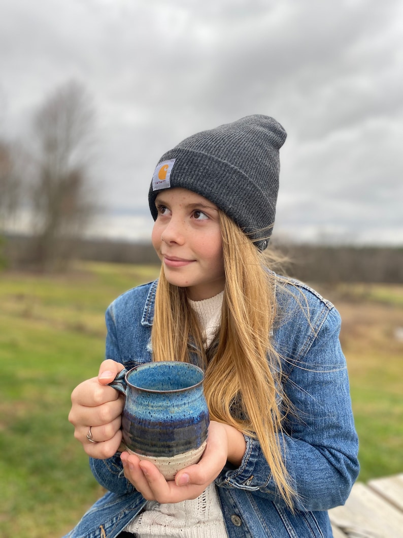 girl holding a Navy Ceramic Coffee Mug