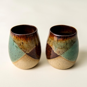 Set of two hand thrown Brown and Green stemless wine glasses.