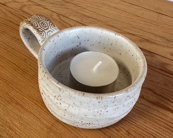 Small tea light candle holder with textured handle