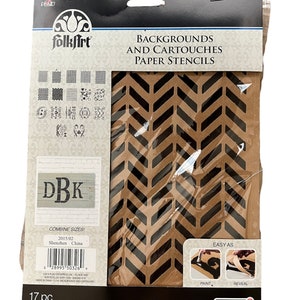 May include: A package of 17 FolkArt paper stencils for backgrounds and cartouches. The stencils are made of brown paper with black cutouts. The package shows a chevron pattern stencil. The text "COMBINE SIZES!" and "2015/02 Shenzhen China" is printed on the package.