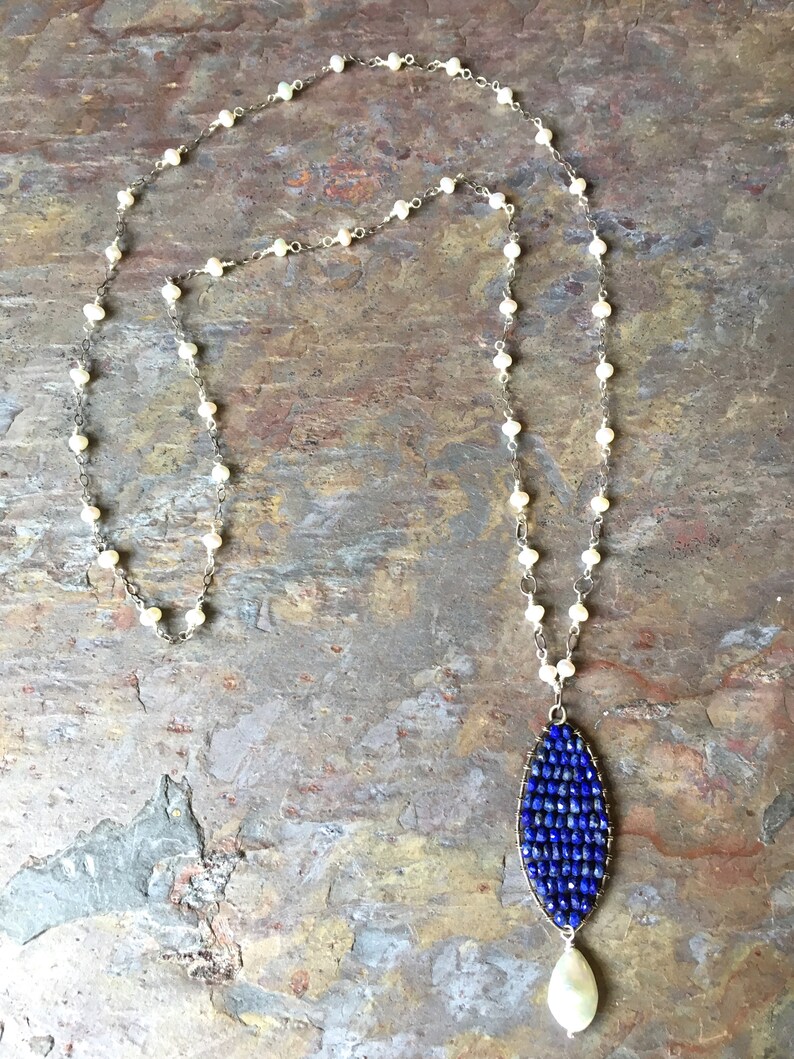 Freshwater pearl long silver necklace with a lapis and pearl pendant