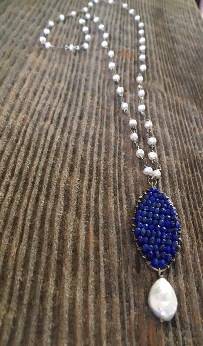 Freshwater pearl long silver necklace with a lapis and pearl pendant