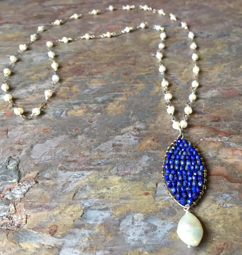 Freshwater pearl long silver necklace with a lapis and pearl pendant