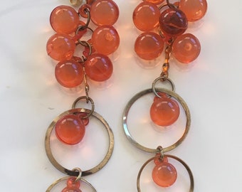 orange colored earrings 1980