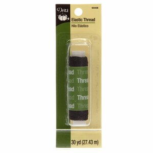 May include: A spool of black elastic thread, labeled "Dritz Elastic Thread" and "Hilo Elástico", with a green pumpkin logo. The spool contains 30 yards (27.43 meters) of thread.