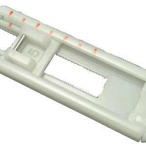 May include: White plastic sewing machine foot with red markings and a number "5" printed on it.