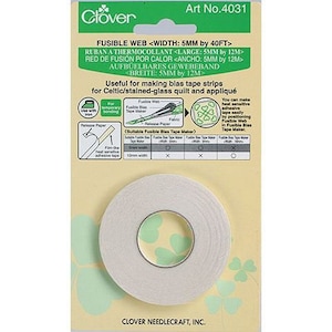 May include: A roll of white fusible web tape, 5mm wide, on a yellow and green packaging with the text "Clover" and "Art No. 4031". The packaging also includes instructions for using the tape to make bias tape strips for Celtic and stained-glass quilts.