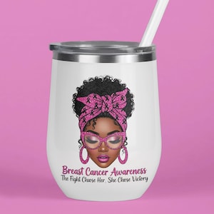 May include: White insulated tumbler with a silver rim and a white straw. The tumbler features an illustration of a woman with a pink headscarf, glasses, and earrings. Text on the tumbler reads "Breast Cancer Awareness: The Fight Chose Her, She Chose Victory."