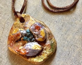 Pendant painted in golden ,light purple .copper and light brown pebble stone  or semi precious stone  with brown satin cord  gift for her