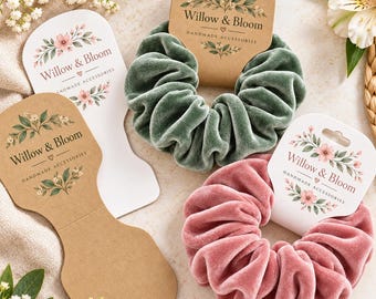 May include: Two velvet hair scrunchies, one sage green and one dusty rose, each attached to a branded Willow & Bloom card. The cards feature floral illustrations and the text Willow & Bloom Handmade Accessories. An empty brown card is also visible.