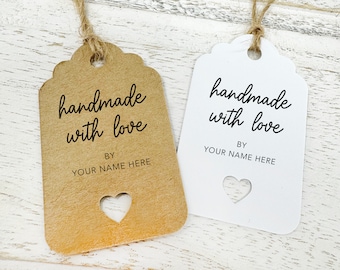 May include: Two gift tags with the text "handmade with love" and "by your name here". The tag on the left is brown with a heart cut out. The tag on the right is white with a heart cut out.